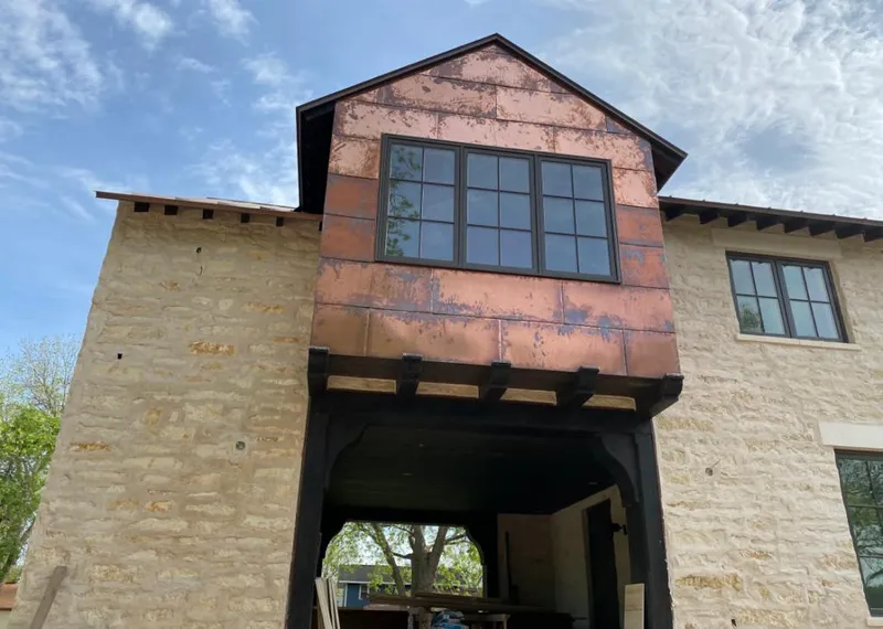 Copper metal panel facade on a stone building for Roof Repair in West Rockhill